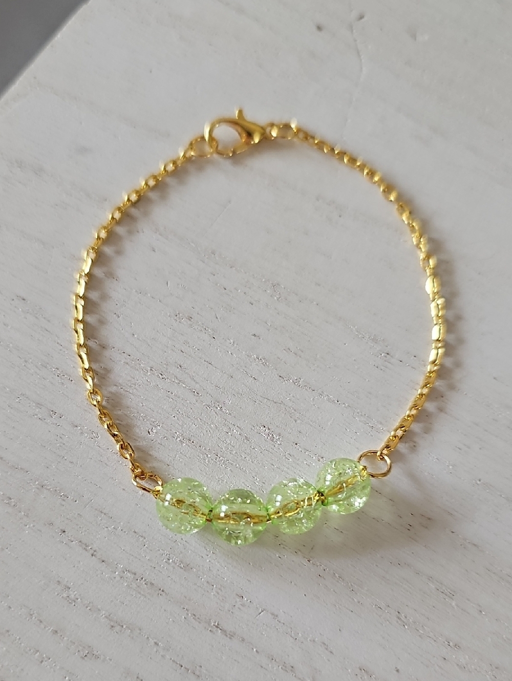 Gold Tone Bracelet with Light Green Bead Accents
